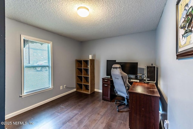 office with a textured ceiling and dark hardwood / wood-style floors