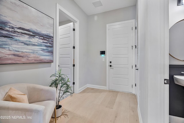 foyer entrance with light hardwood / wood-style floors