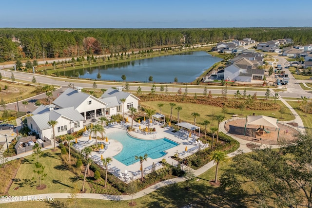 birds eye view of property with a water view