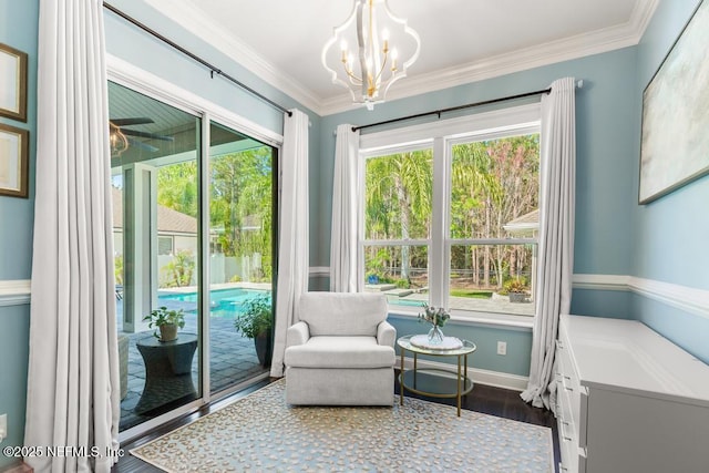 living area with baseboards, plenty of natural light, dark wood-style floors, and crown molding