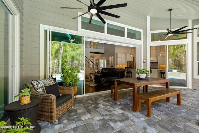 sunroom / solarium with ceiling fan