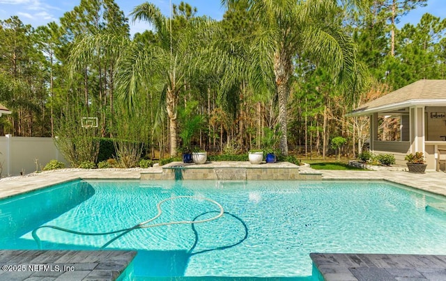 pool with an outdoor structure and fence