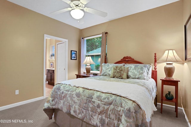 carpeted bedroom with connected bathroom and ceiling fan