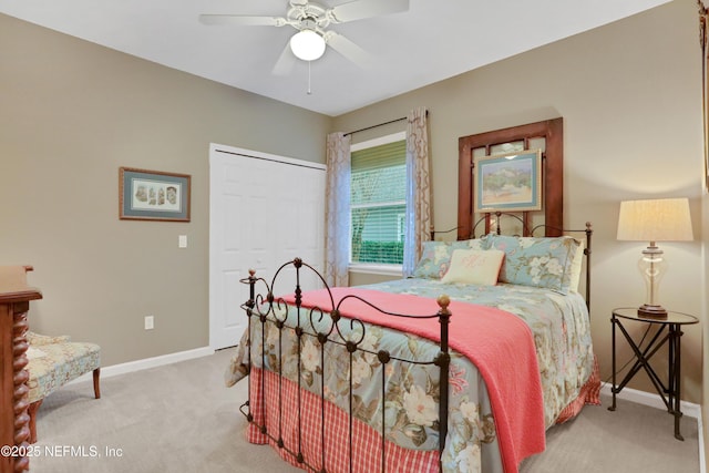 carpeted bedroom with a closet and ceiling fan