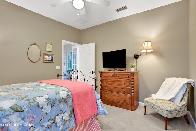 bedroom with ceiling fan and light colored carpet