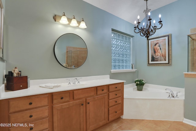 bathroom featuring vanity, tile patterned floors, and a bathtub