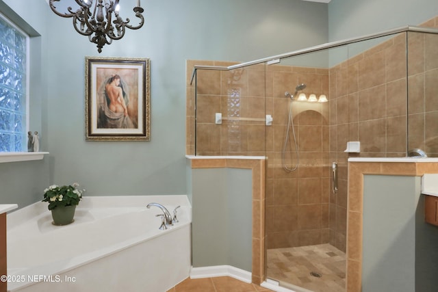 bathroom with vanity, a chandelier, independent shower and bath, and tile patterned flooring