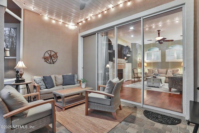 interior space with ceiling fan and an outdoor living space