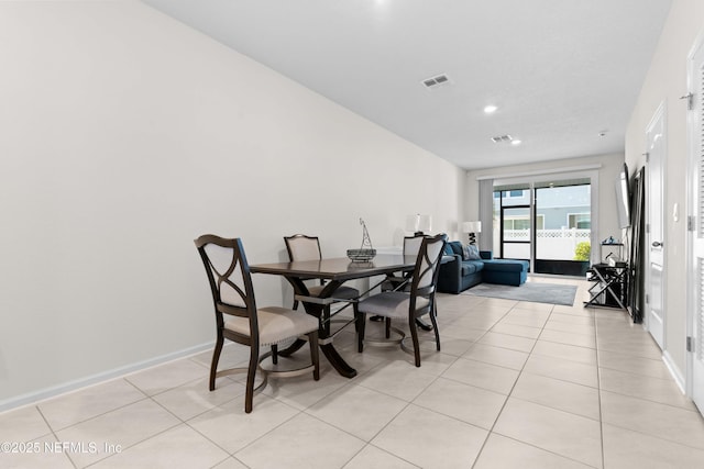 dining area featuring light tile patterned floors