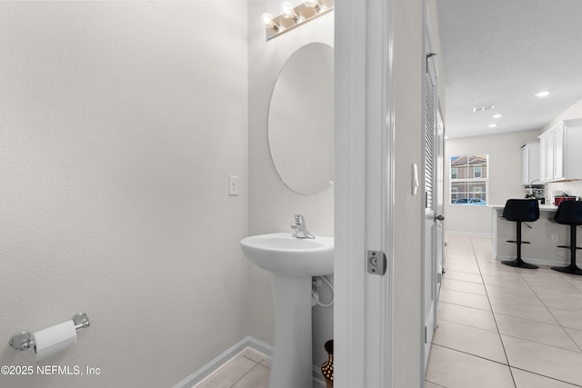 bathroom with tile patterned floors and sink