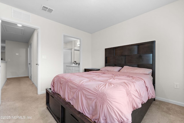 carpeted bedroom with ensuite bath