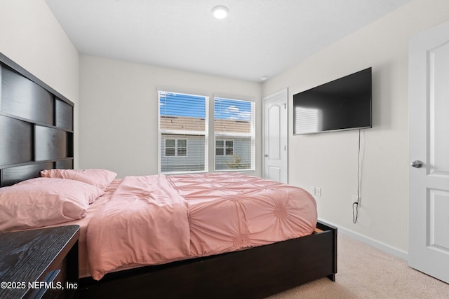 bedroom with light carpet