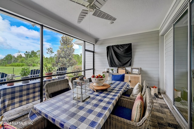 sunroom / solarium with ceiling fan