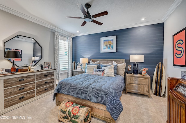 carpeted bedroom with ceiling fan, a textured ceiling, wood walls, and ornamental molding