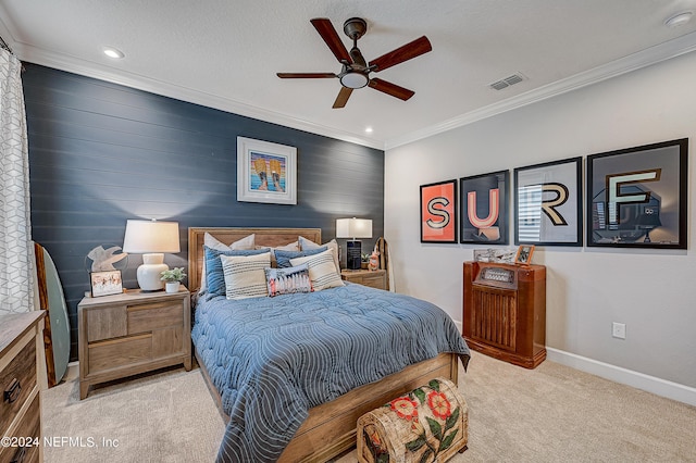 carpeted bedroom with crown molding, a textured ceiling, and ceiling fan