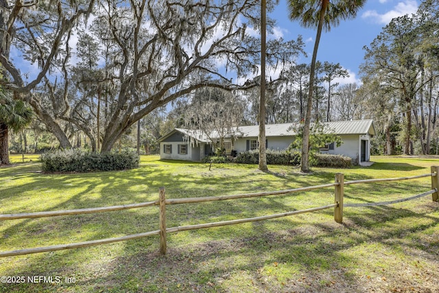 single story home with a front yard