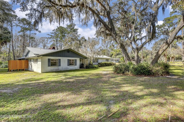 view of home's exterior with a lawn