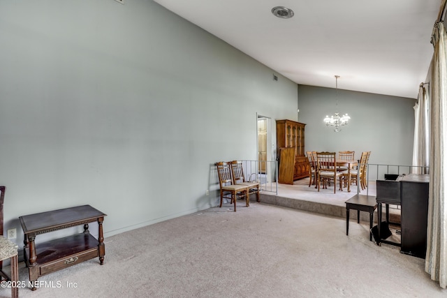 living area featuring a chandelier, high vaulted ceiling, and carpet