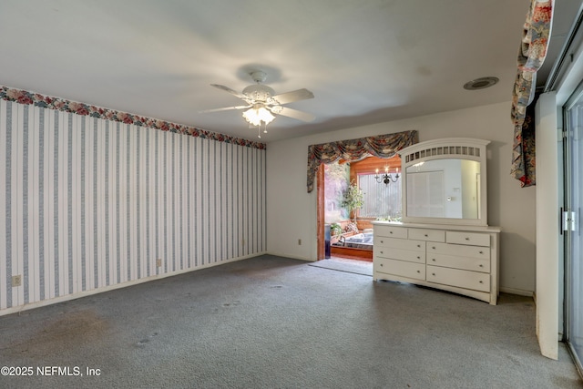 unfurnished bedroom with ceiling fan and carpet floors