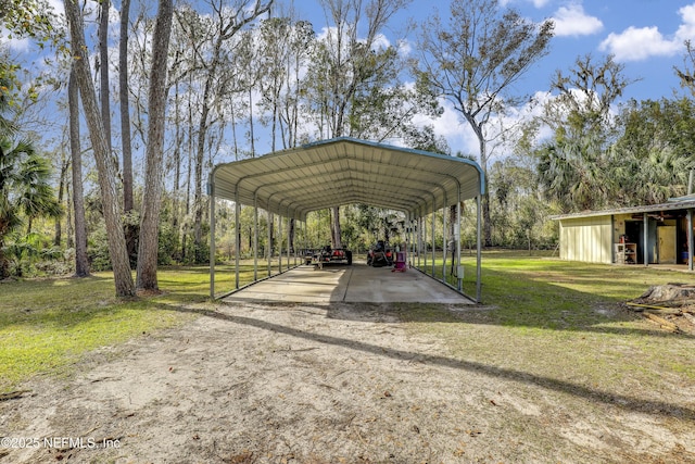 view of parking with a lawn and a carport