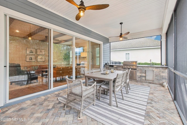 sunroom with sink and ceiling fan