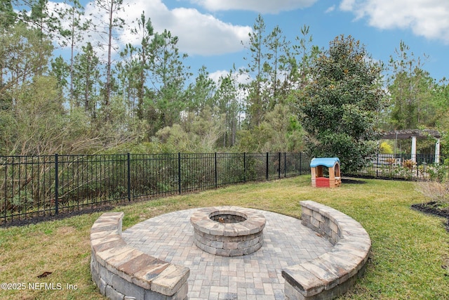 view of patio with a fire pit and a playground