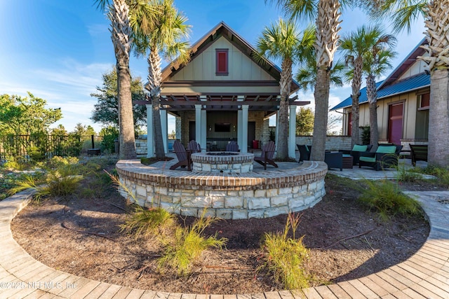 view of patio / terrace featuring an outdoor fire pit