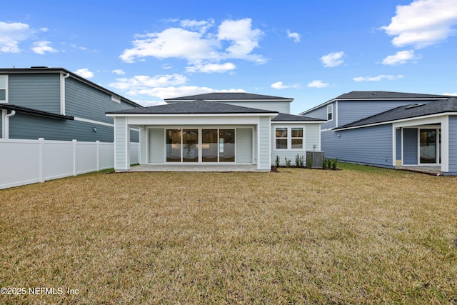 back of property featuring a yard, a patio, and central air condition unit