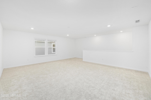 empty room featuring light colored carpet