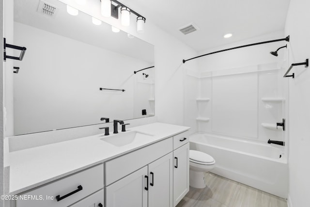 full bathroom featuring vanity, shower / washtub combination, and toilet