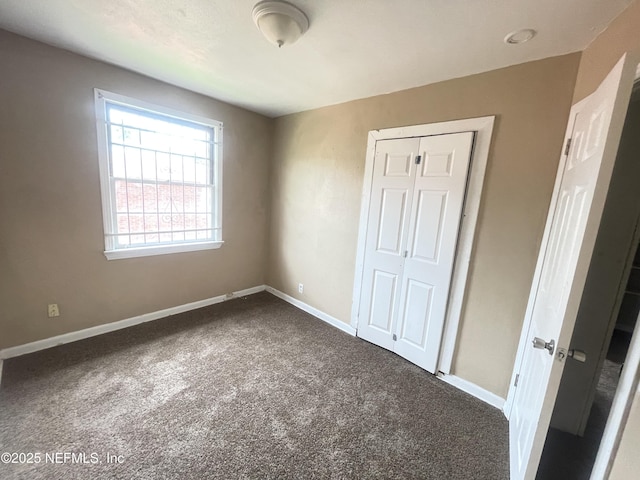 unfurnished bedroom featuring a closet and carpet