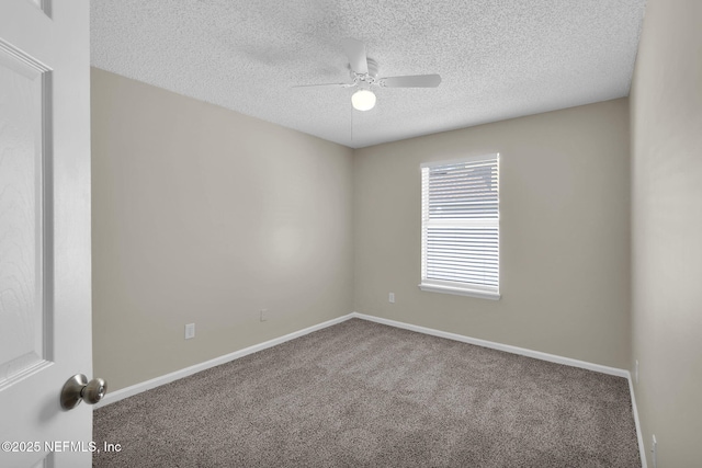 unfurnished room with a textured ceiling, ceiling fan, and carpet