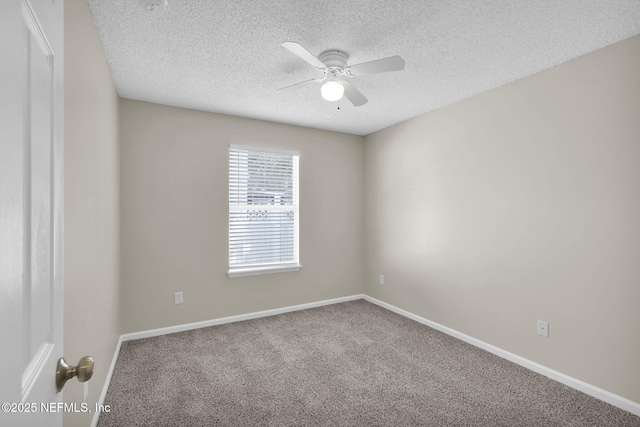 unfurnished room featuring ceiling fan, carpet flooring, and a textured ceiling