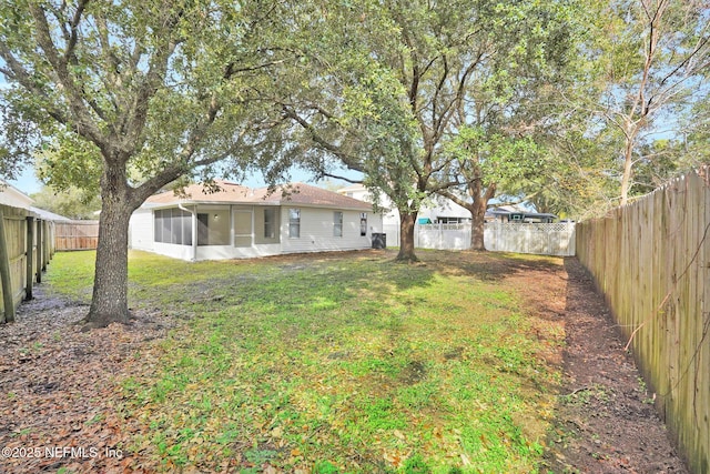 view of yard with a sunroom