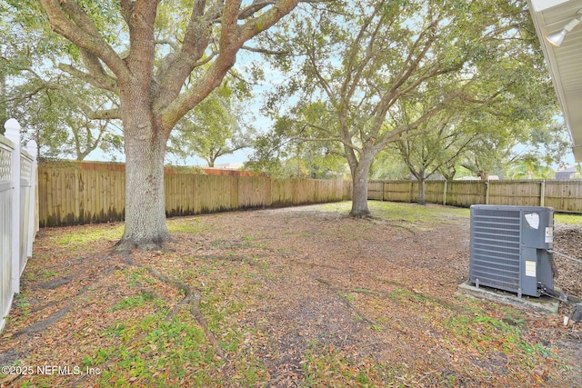 view of yard with central AC unit