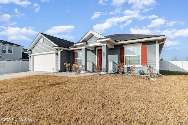 view of front of house featuring a garage and a front yard