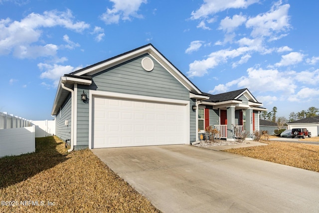 view of front of property with a garage and covered porch