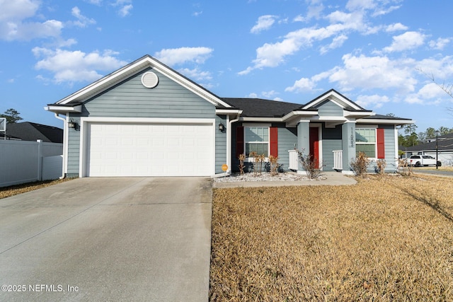 single story home featuring a garage and a front lawn