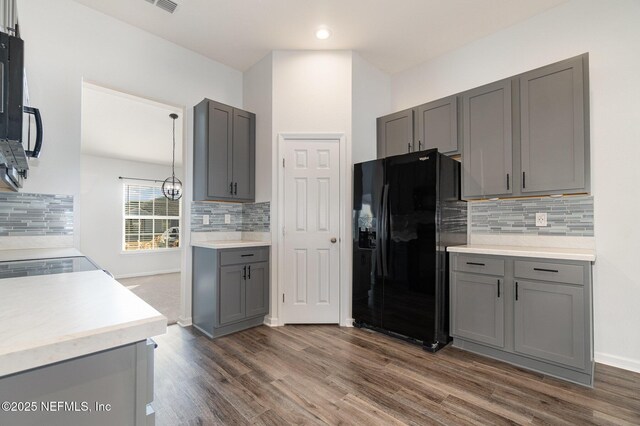 kitchen featuring gray cabinetry and black appliances