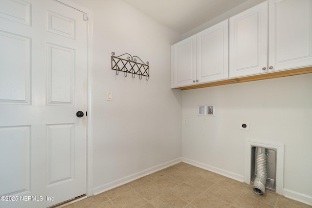 washroom with cabinets, hookup for a washing machine, and hookup for an electric dryer