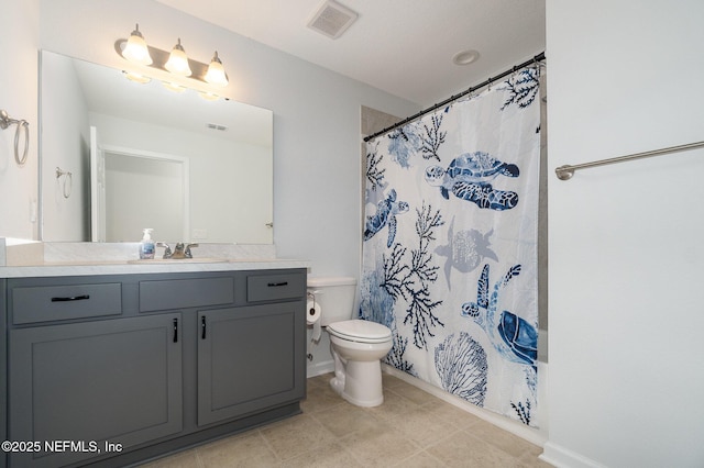 bathroom featuring walk in shower, tile patterned floors, vanity, and toilet