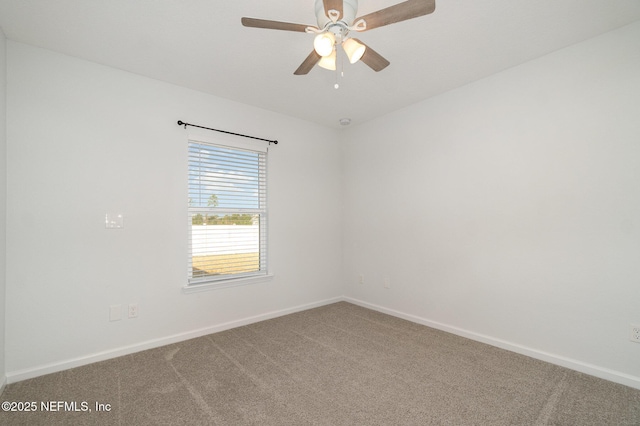 empty room featuring ceiling fan and carpet floors