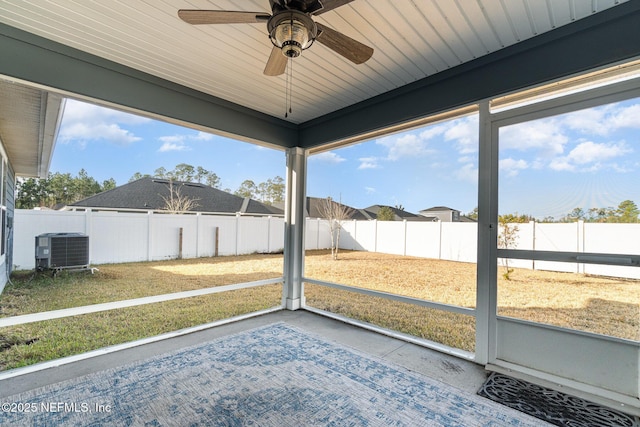 unfurnished sunroom featuring ceiling fan