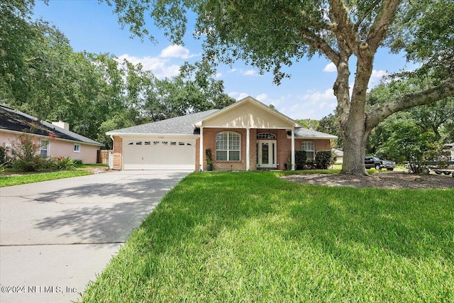 ranch-style home featuring a garage and a front yard