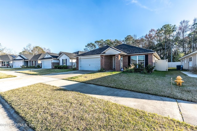 ranch-style house with a garage, central AC, and a front yard