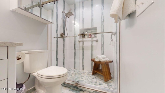 bathroom featuring walk in shower and toilet