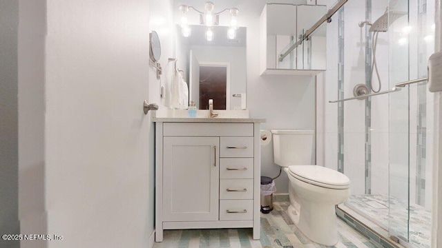 bathroom featuring vanity, hardwood / wood-style floors, a shower with door, and toilet