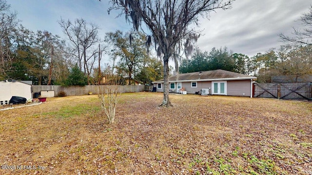 view of yard featuring french doors