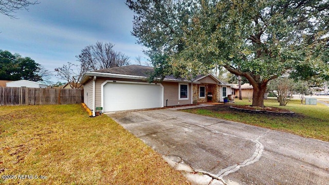 ranch-style house featuring a garage and a front lawn