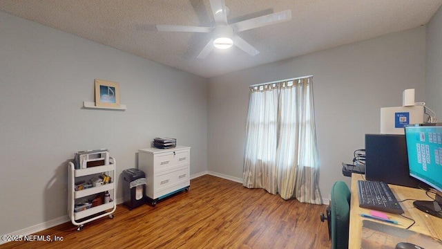 office area featuring hardwood / wood-style floors, a textured ceiling, and ceiling fan